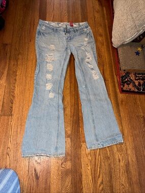 Distressed Light Blue Flare Jeans - Women's